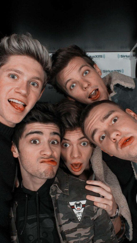 One Direction: Charismatic Charmers Strike Playful Poses in Candid Snapshot Wallpaper