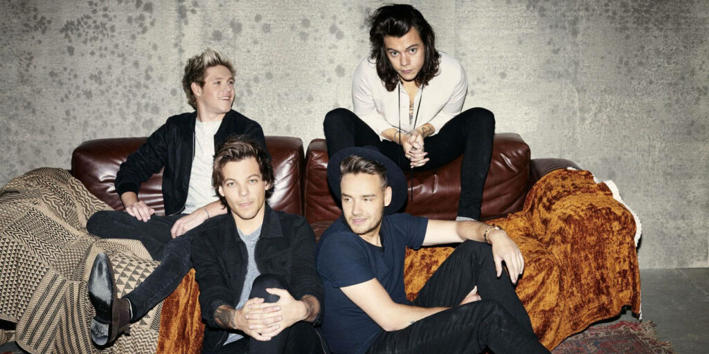Dynamic Unity: One Direction Sets the Stage Ablaze with their Mesmerizing Melodies Wallpaper