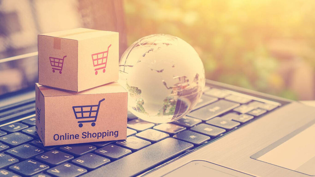 Online Shopping Wallpaper: Small Boxes on Laptop Keyboard & Globe