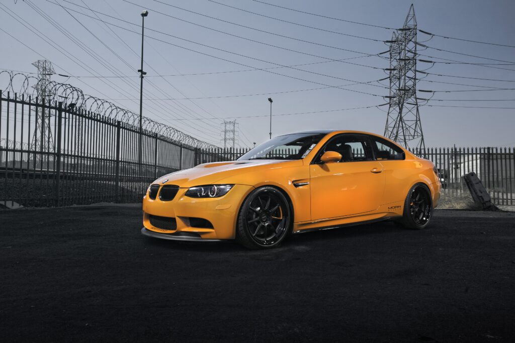 Orange BMW M3 E92 in Industrial Setting | Stunning Wallpaper