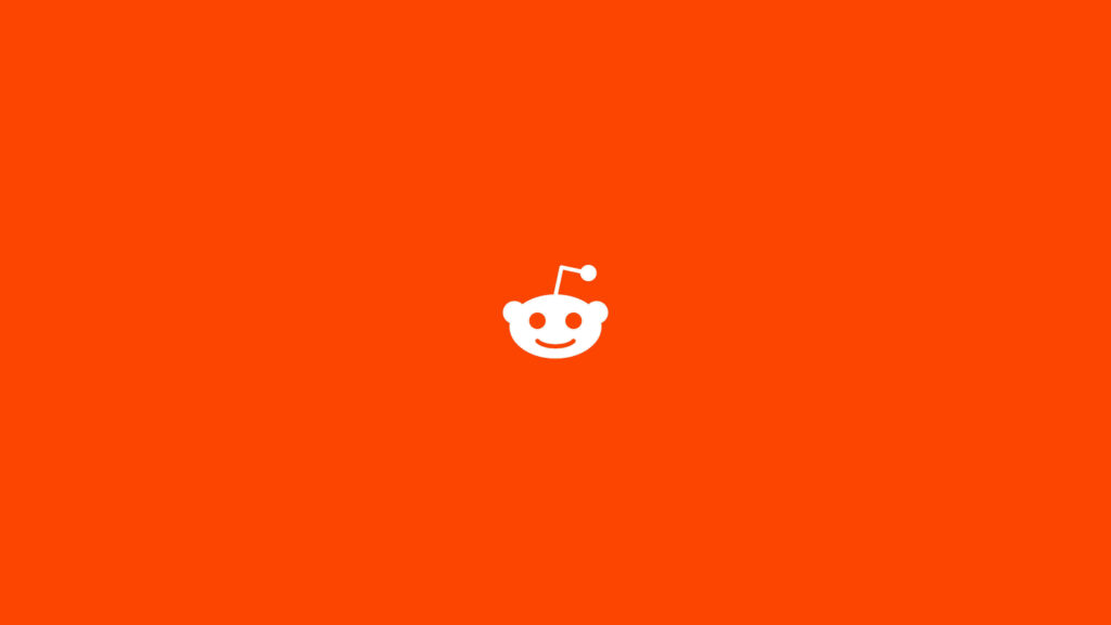 Orange Bliss: A Stunning Minimalist Reddit Wallpaper with Snoo's Iconic Logo