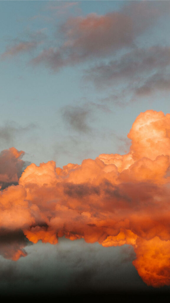 Enchanting Orange Clouds Captured in a Vibrant Phone Wallpaper