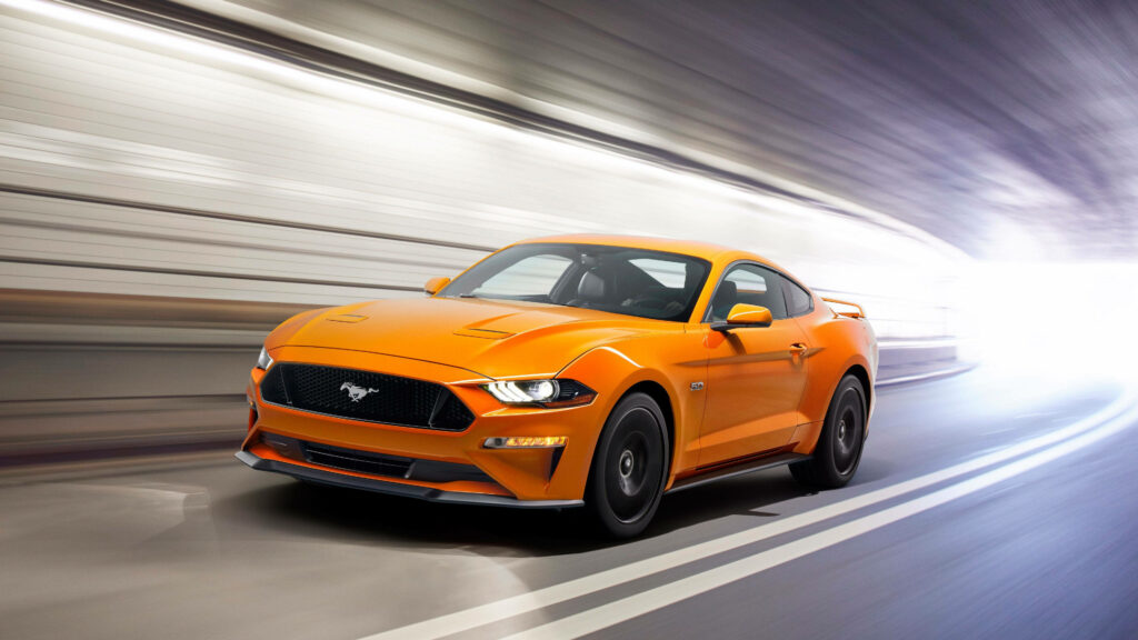 Orange Mustang racing through tunnel high speed 4K Ultra HD dynamic car wallpaper background