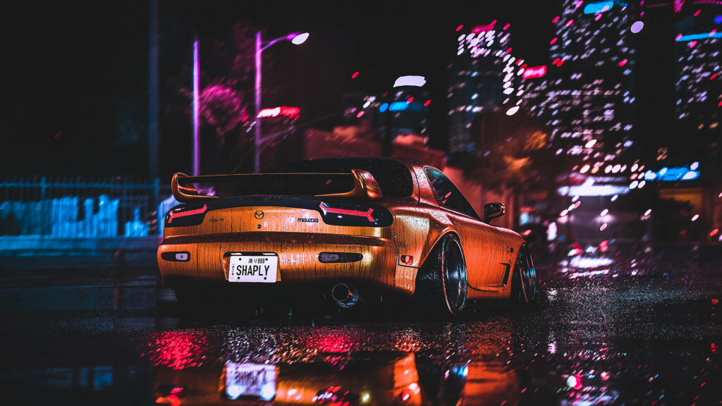 Orange RX7 sports car gleaming with raindrops under city lights on wet pavement at night wallpaper