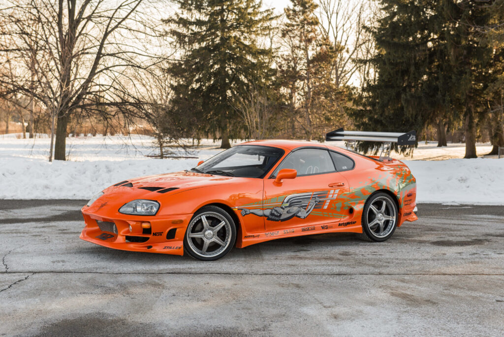 Orange Toyota Supra Fast and Furious 1 with custom mods in snowy outdoor wallpaper background