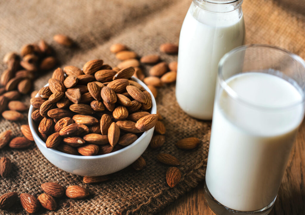 Organic Almond Milk Wallpaper: Rustic Background with Fresh Almonds