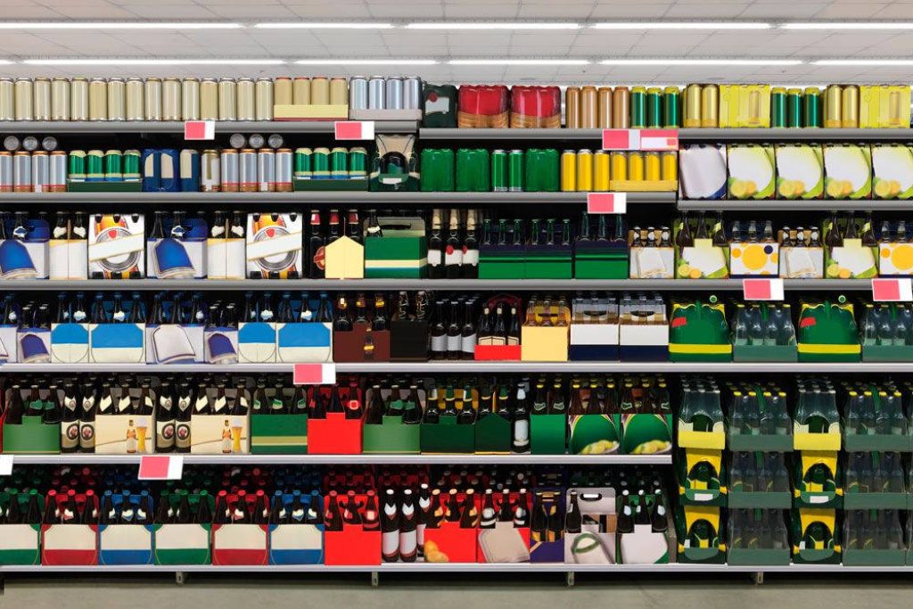 Supermarket liquor aisle with organized rows of assorted beer bottles and cans on shelves Wallpaper