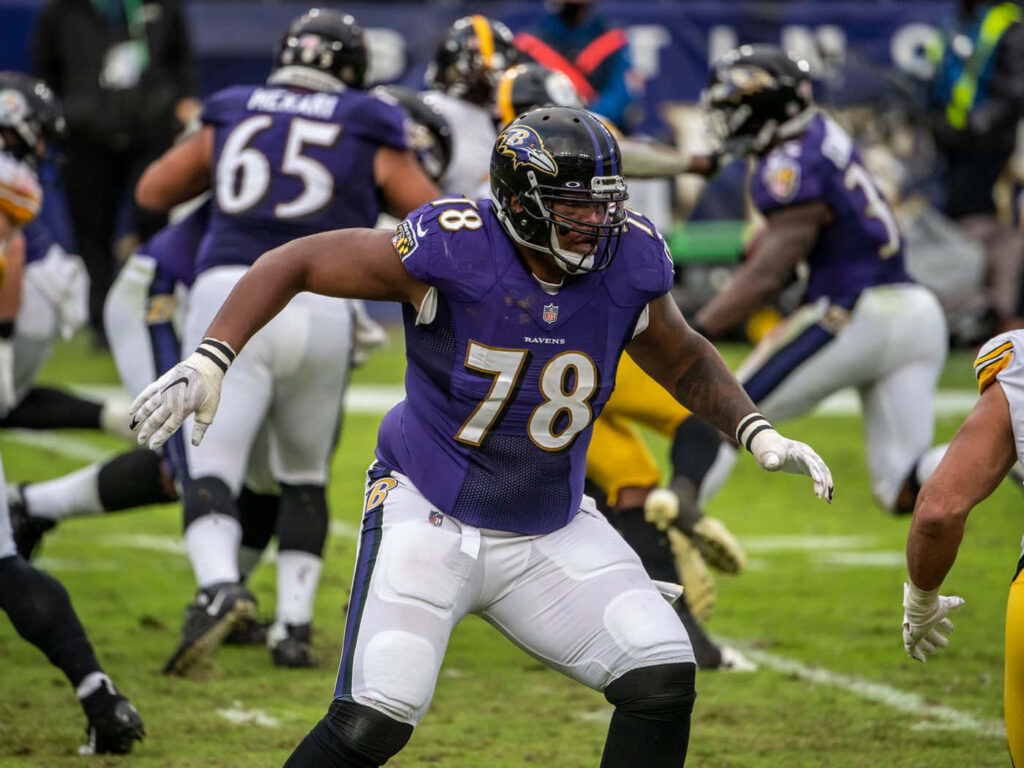 Orlando Brown Jr Baltimore Ravens in action NFL player intense game wallpaper background