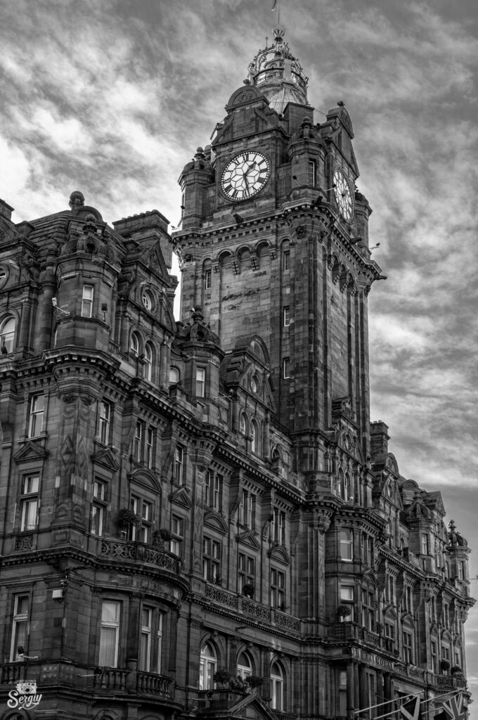Ornate Black and White Wallpaper with Clock Tower Architectural Design