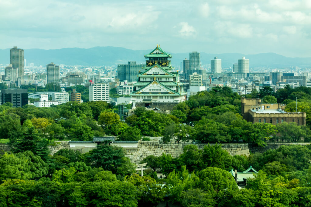 Osaka Castle Cityscape Wallpaper: Modern & Green Urban Blend