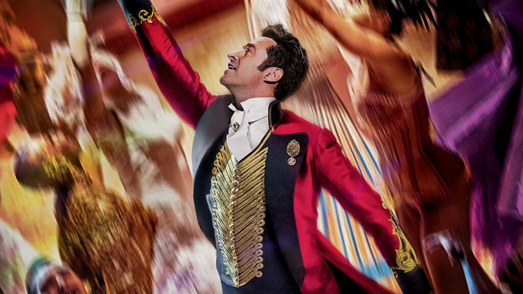 Vibrant wallpaper of P.T Barnum in red ringmaster costume Circus background The Greatest Showman