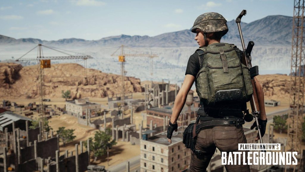 PUBG character in Level 1 gear overlooking Miramar map in detailed 3D battle royale wallpaper