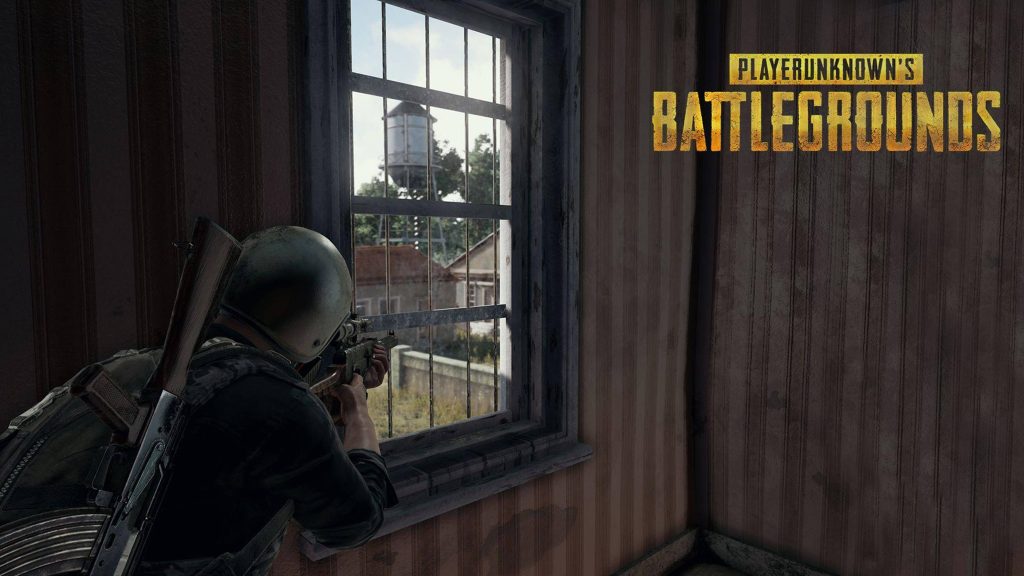 PUBG player aims rifle through window overlooking rural landscape with water tower wallpaper