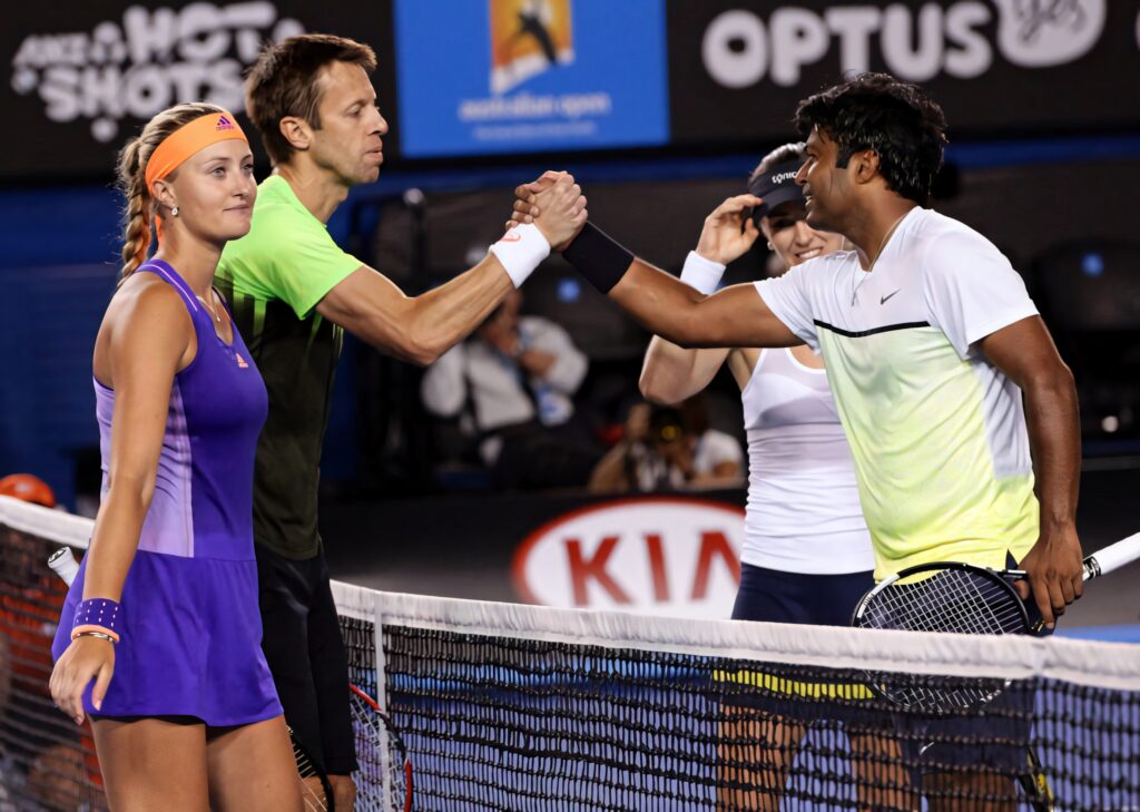 Paes and Hingis shake hands at net after mixed doubles match vs Nestor and Kristina Australian Open Wallpaper