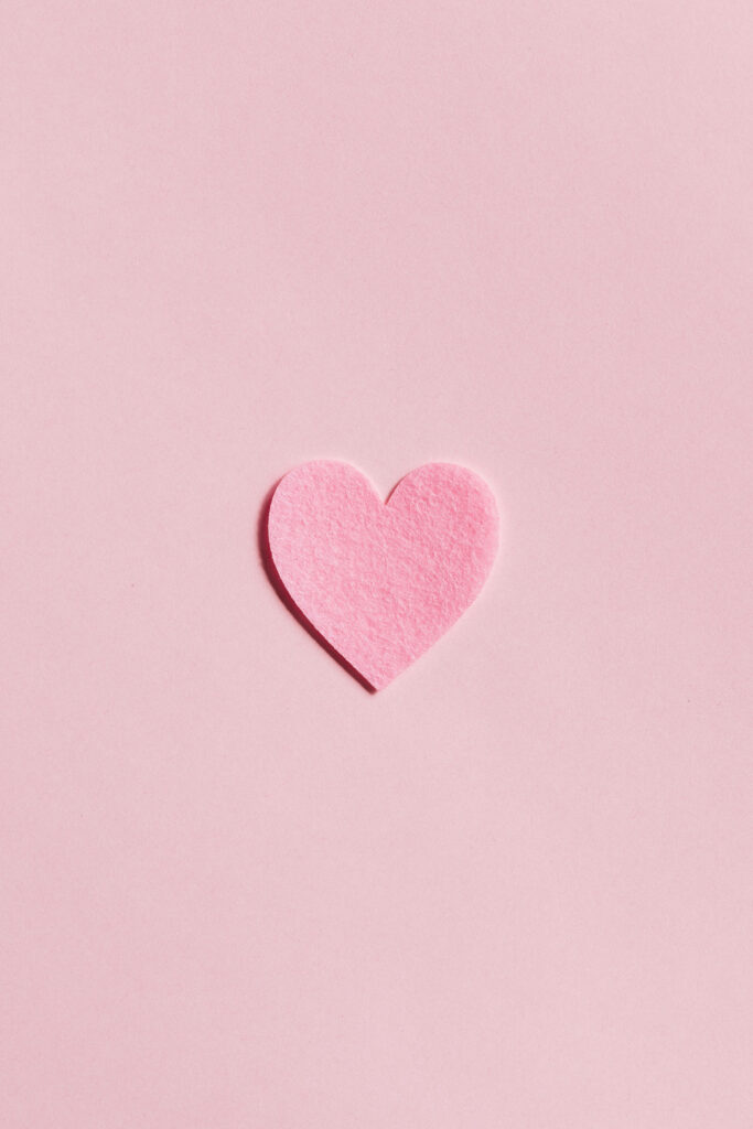 Whimsical Pink Heart Popping Against Delicate Background Wallpaper