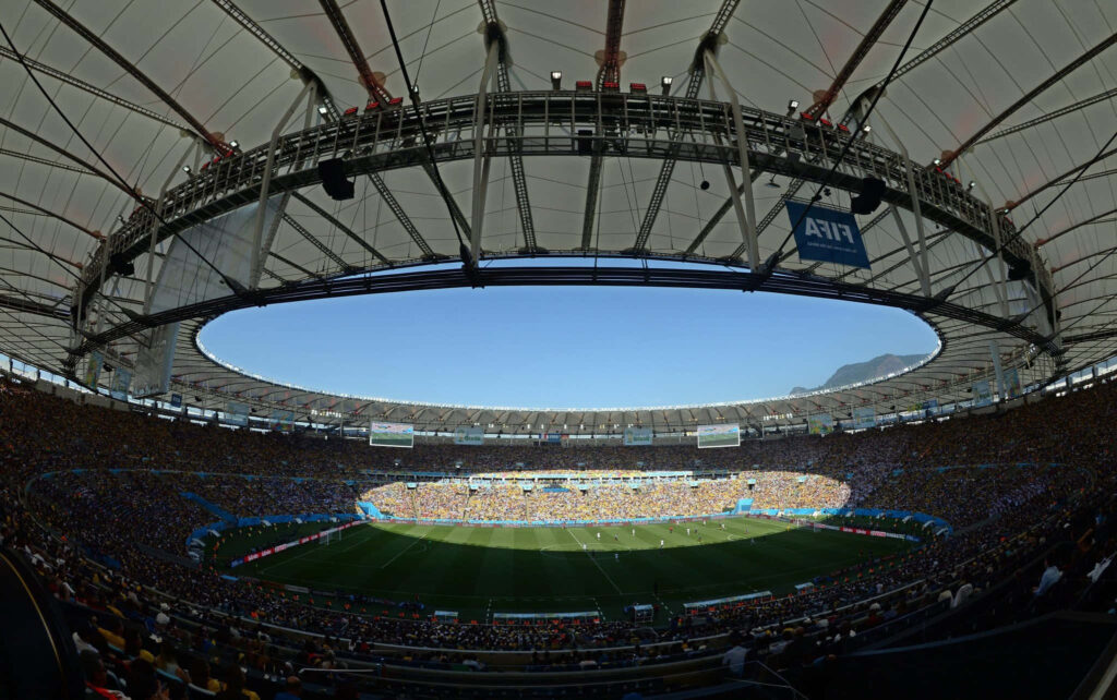 Vibrant Crowd Energized by Soccer Match Seen in Captivating Stadium Photo Wallpaper