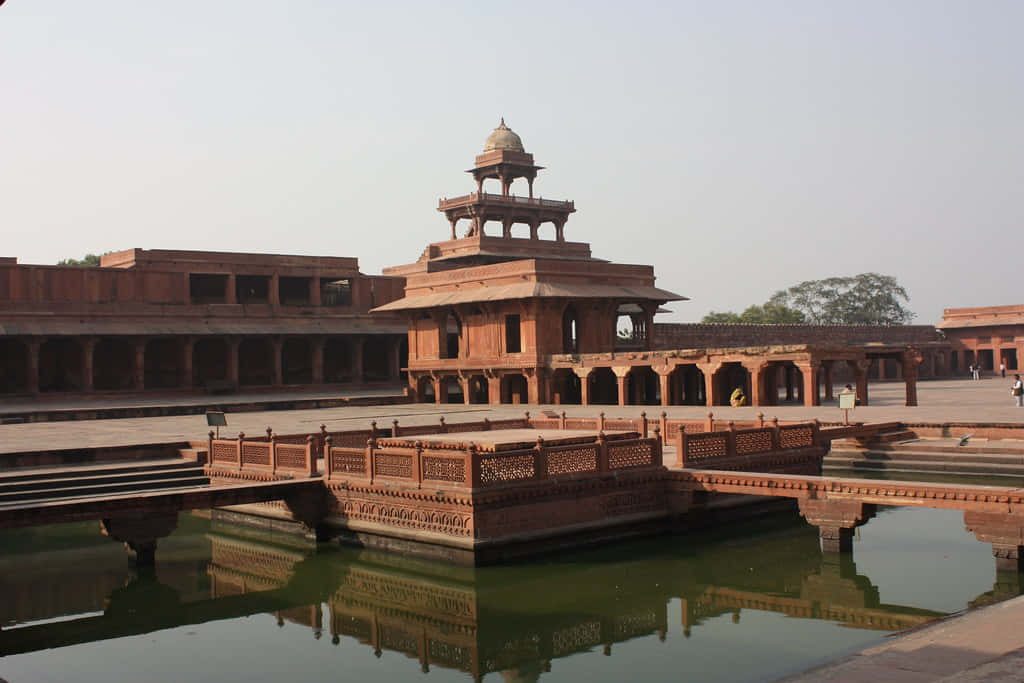 Panch Mahal Fatehpur Sikri red sandstone five-story Mughal architecture reflected in pool wallpaper