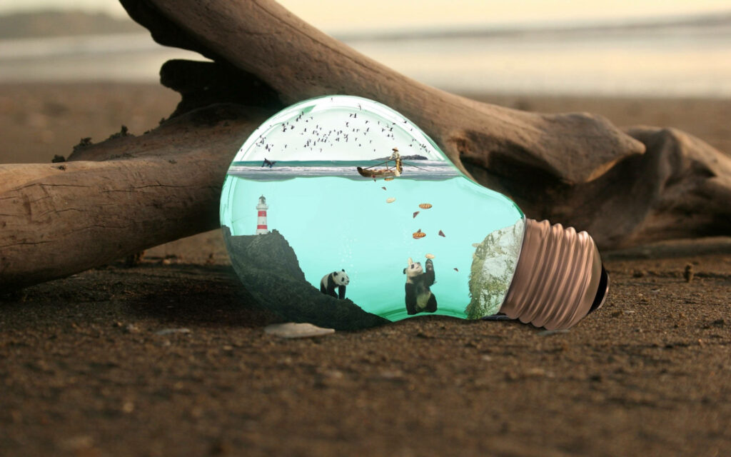 Harmony Amidst the Elements: A Captivating Wallpaper of Pandas, Aquatic Life, and a Small Boat Within a Water-filled Bulb