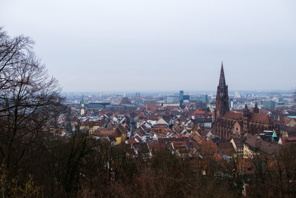 Stunning Historic Cityscape Wallpaper: Gothic Tower & Charming Buildings