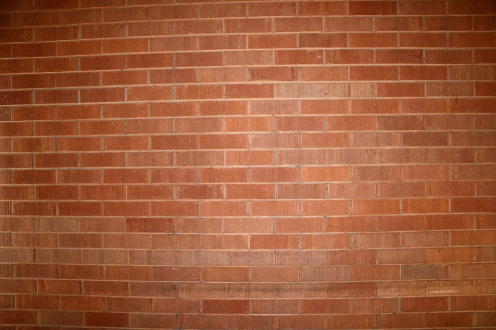 Textured Red Brick Wall: Perfect Wallpaper Background for Architecture