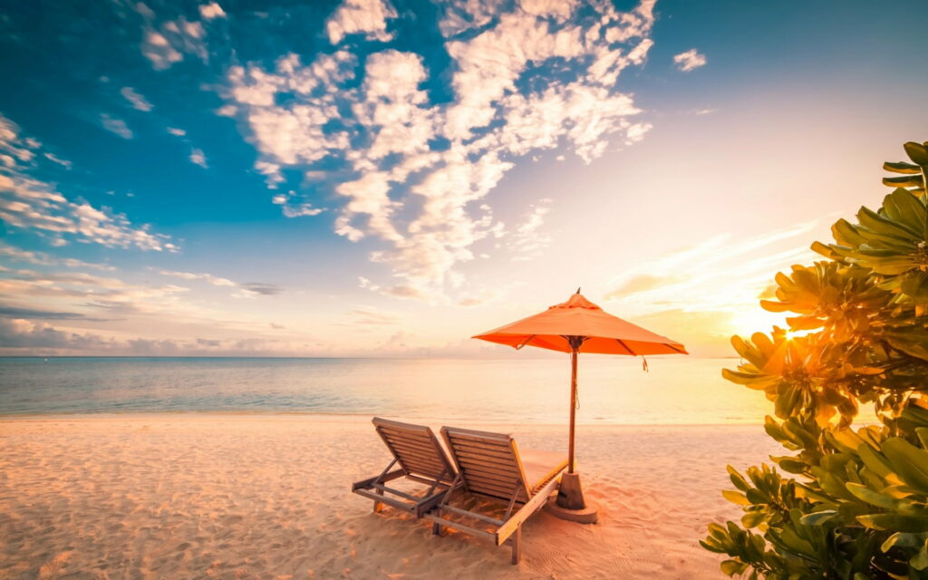 Sunset Serenity: Embracing Tropical Paradise on a Dreamy Beach Wallpaper