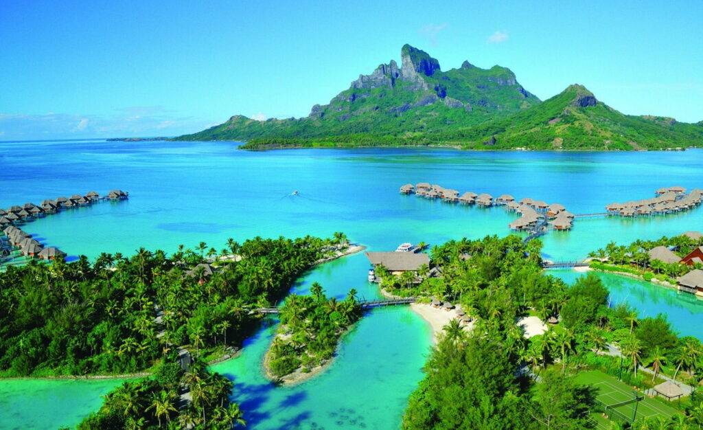 Tropical Paradise: Serene Papeete, French Polynesia - Captivating Hills, Islands, and Tranquil Huts Amidst Breathtaking Ocean Views Wallpaper