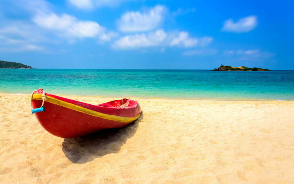 Paradise Found: Exploring the Tranquil Shores of a Tropical Island Wallpaper