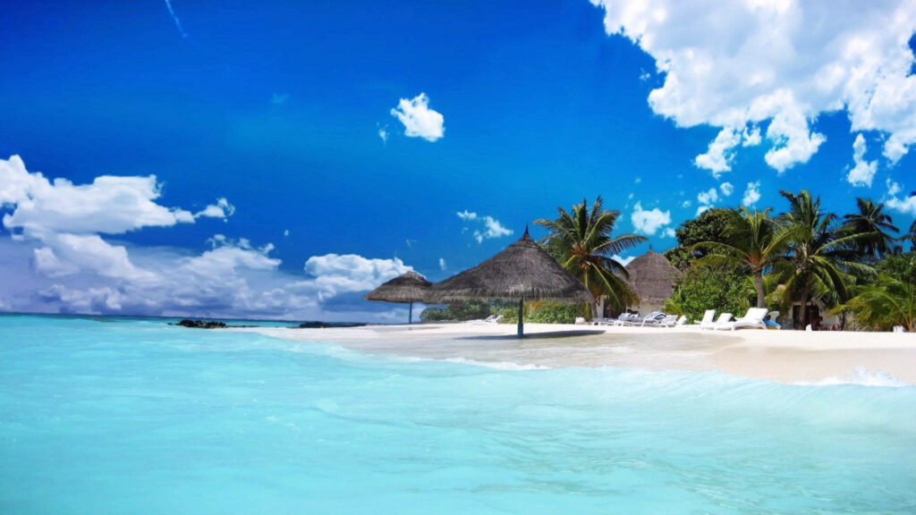 A Serene Slice of Tropical Bliss: Sao's Immaculate Beach Haven with Chic Nipa Hut Umbrella Design Wallpaper