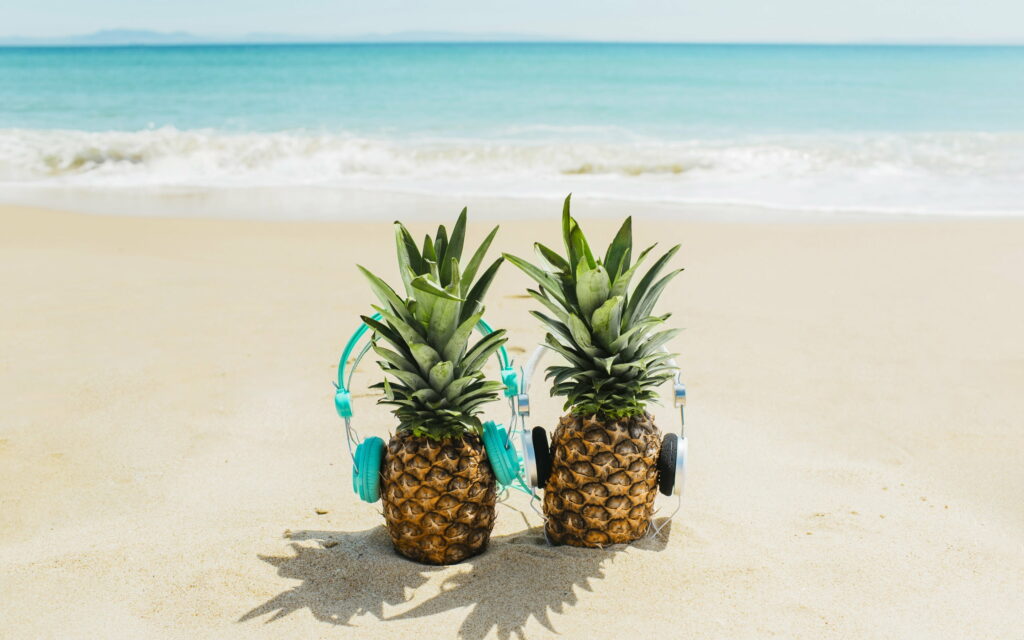 Sandy Paradise: A Blissful Tropical Beach Retreat with Pineapple Delights Wallpaper