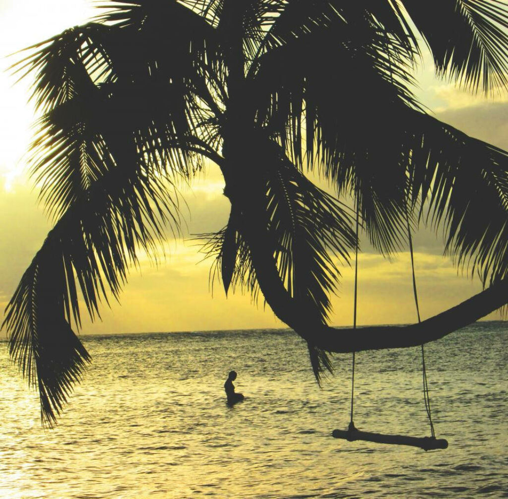 Paradise Found: Sunset Delights and Tranquil Oasis on a Tropical Beach Wallpaper