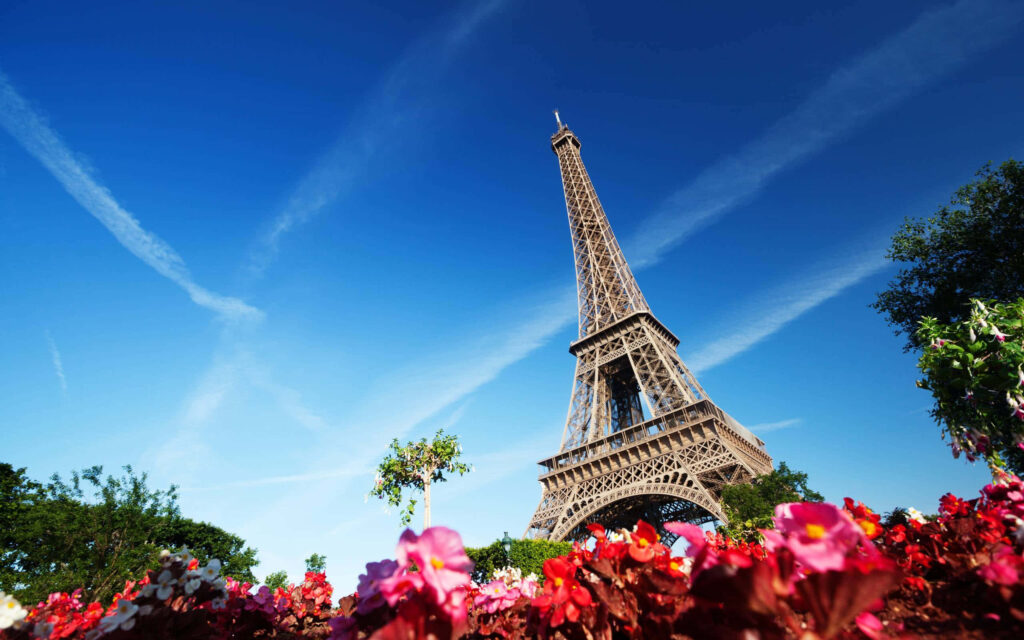 Parisian Landmark: Captivating Skyline beneath the Majestic Eiffel Tower Wallpaper