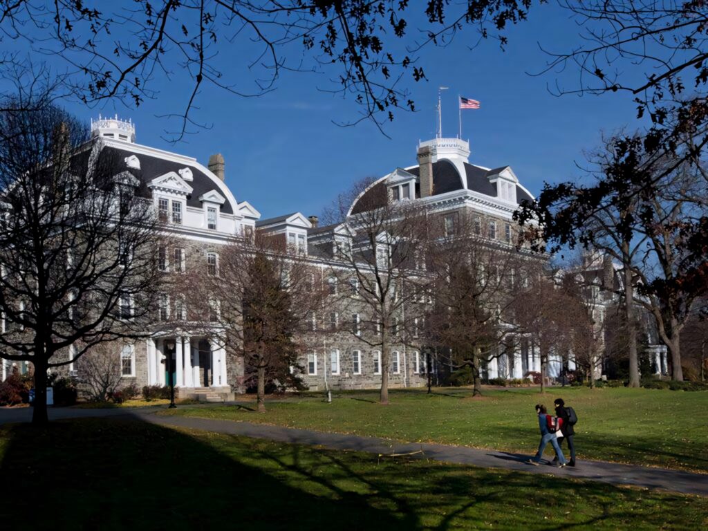 Parrish Hall Swarthmore College historic stone building white roofs autumn campus lawn students Wallpaper