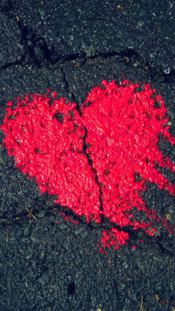 Passionate Red Heart Wallpaper on Textured Dark Surface - Nature's Resilience
