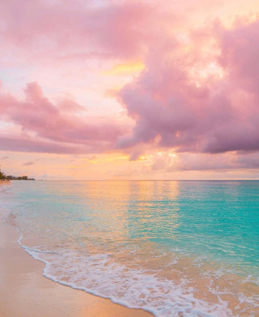 Serene Pastel Beachscape Wallpaper: Sunset on Calm Turquoise Sea
