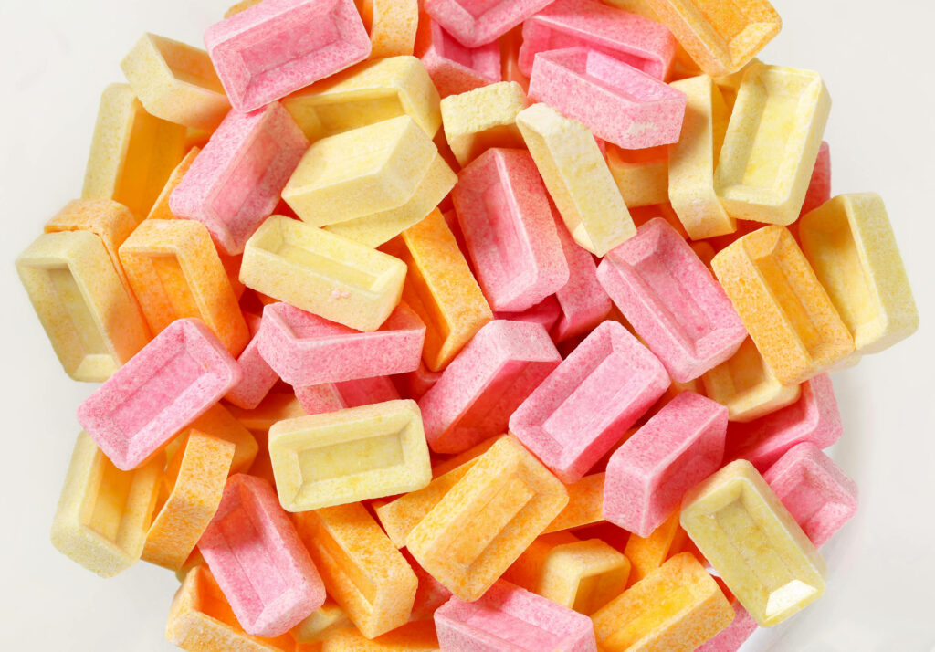 Pastel pink yellow orange candy wallpaper with smooth matte finish vibrant modern design