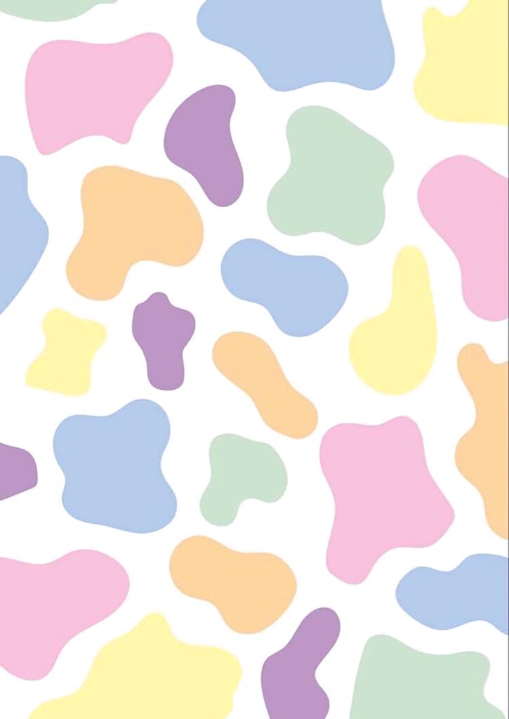 Pastel cow print wallpaper with irregular pink yellow blue green and purple spots on white background
