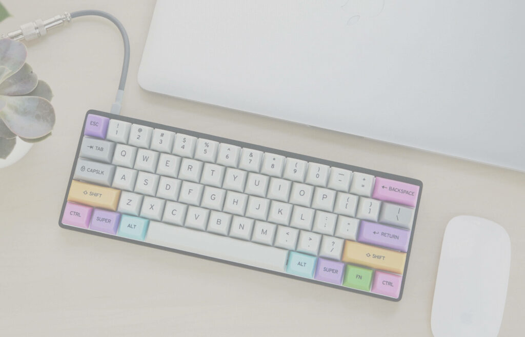 Sleek and Chic: Captivating Pastel Keyboard with Macbook and Mouse in a Minimalist Flat Lay Wallpaper