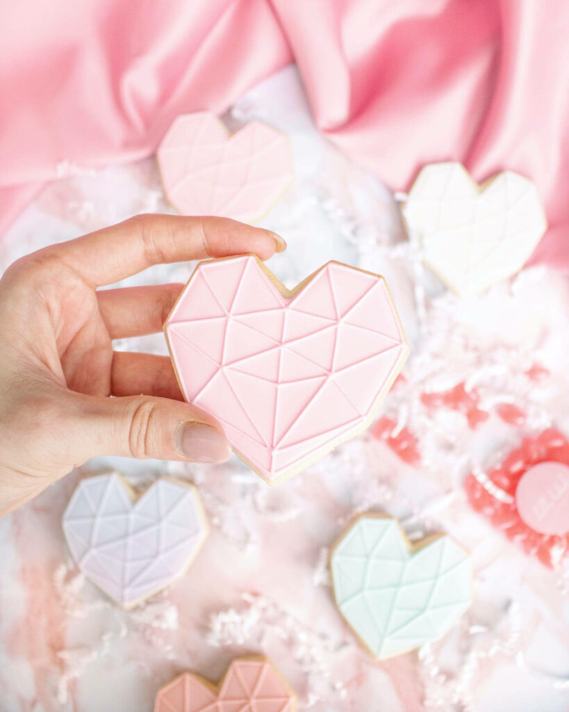 Charming Pastel Pink Heart Cookie Wallpaper with Geometric Patterns