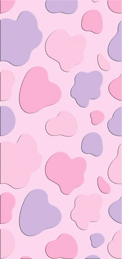 Pastel pink and lavender cow print wallpaper with playful blotches on light pink textured background