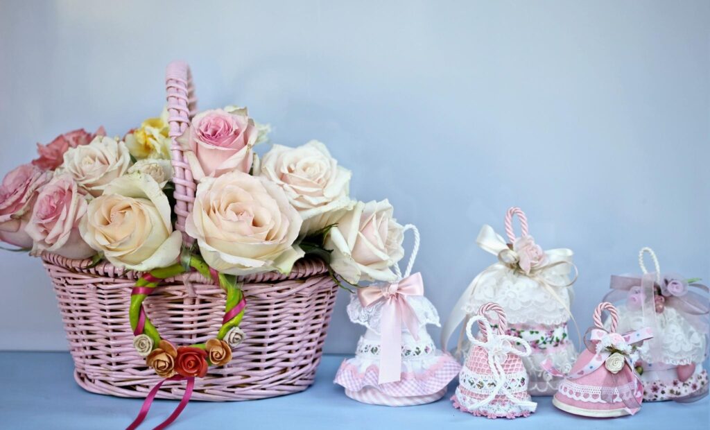 Charming Pastel Pink Wicker Basket with Roses & Decorative Bells Wallpaper