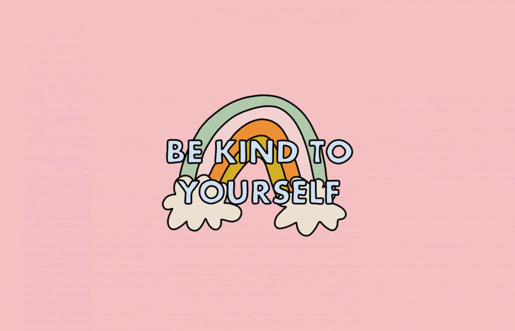 Pastel rainbow wallpaper with fluffy clouds on pink background and Be Kind To Yourself message