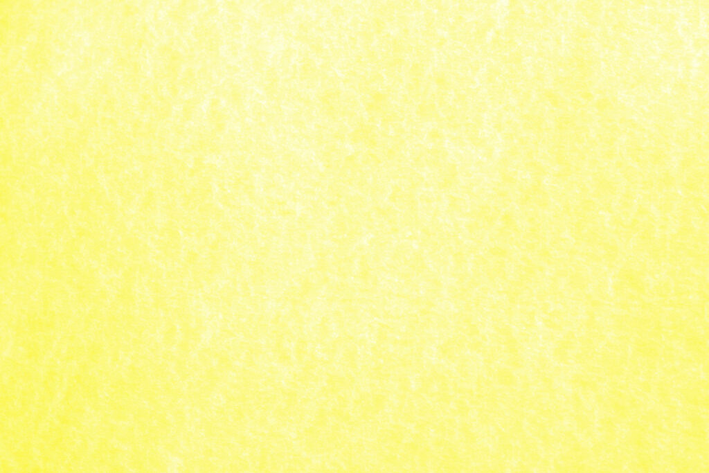 Minimalist yellow desktop wallpaper with pastel paper texture for a calm modern workspace