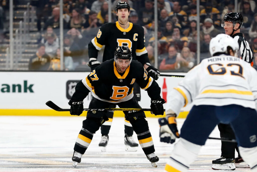 Patrice Bergeron Boston Bruins faceoff vs Buffalo Sabres NHL hockey game dynamic wallpaper