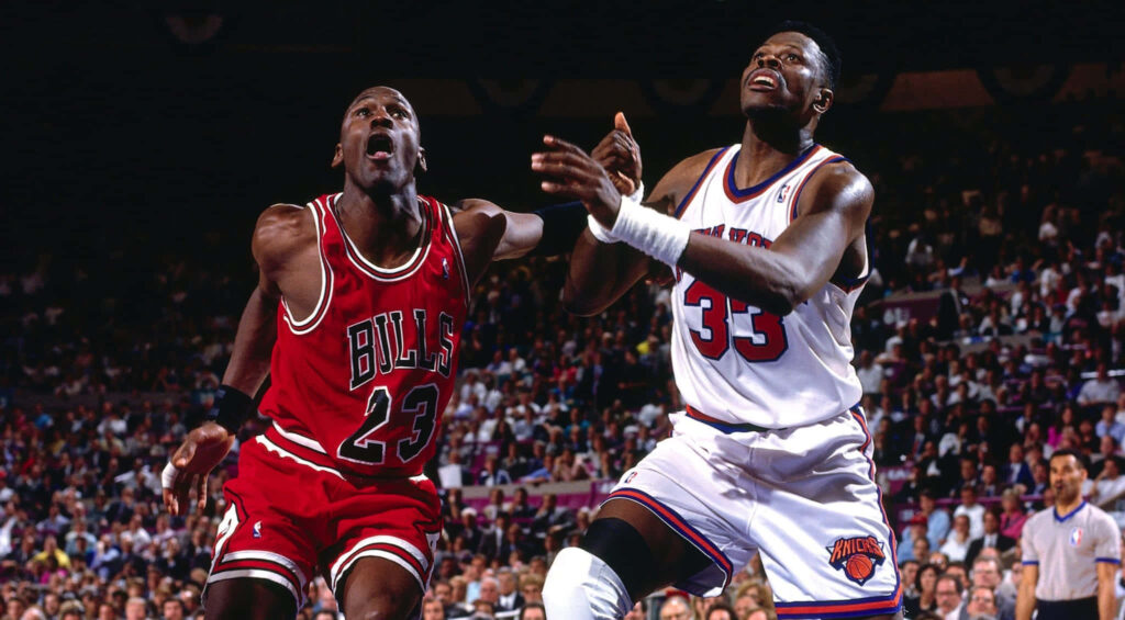 Legendary Rivalry: Patrick Ewing and Michael Jordan Clash in Classic Knicks vs. Bulls Showdown Wallpaper