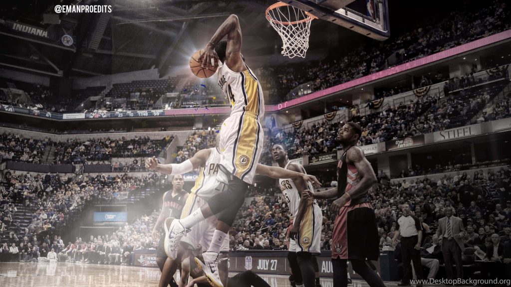 Paul George dunking for Indiana Pacers in intense NBA game versus Toronto Raptors wallpaper