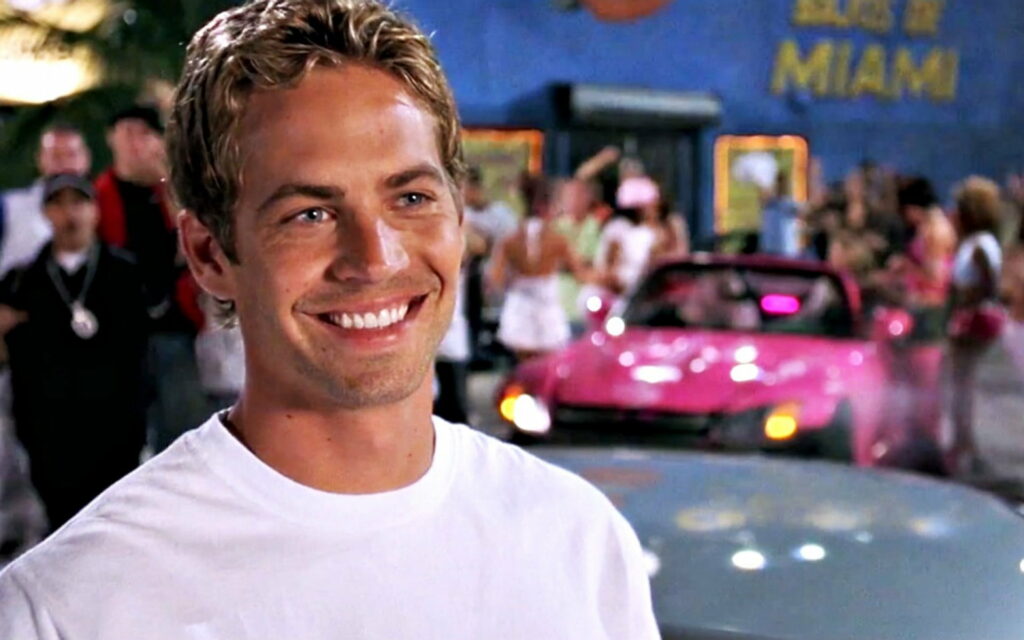 Smiling Fast and Furious Star Paul Walker Poses in Pink and White HD Wallpaper Background
