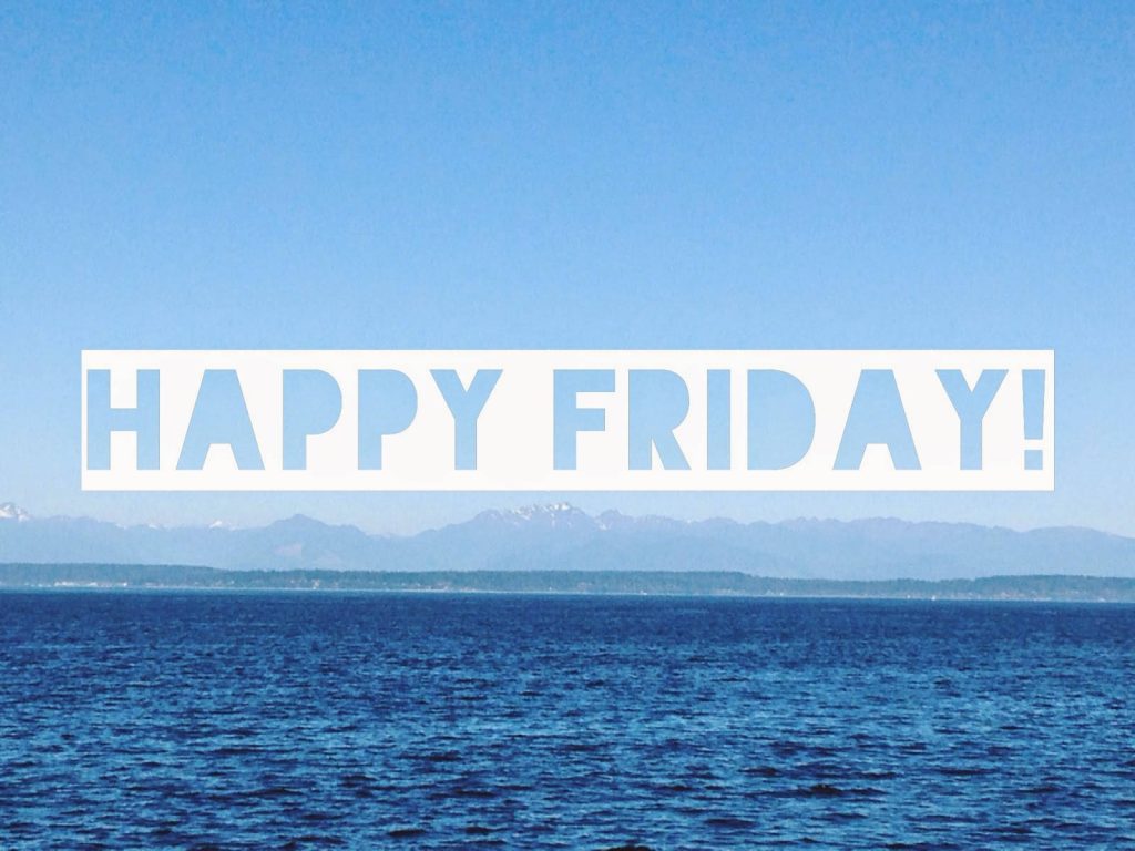 Peaceful Happy Friday wallpaper with deep blue ocean, treeline, snow-capped mountains, clear sky