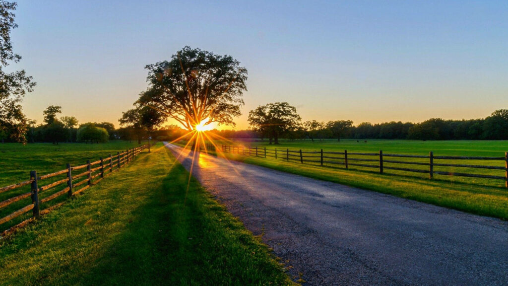Escape to the Serene Countryside: Immerse in the Tranquil Beauty of a Mesmerizing Sunrise Wallpaper