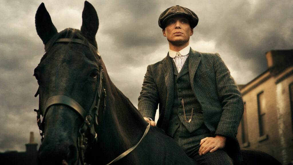 The Immersive World of Thomas Shelby: A Gritty Horseback Ride into the Peaky Blinders Realm Wallpaper