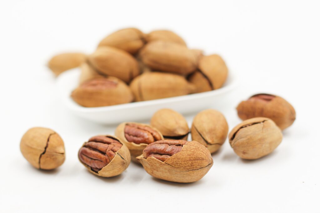 Close-Up of Pecan Nuts: Shelled & Unshelled for Stunning Wallpaper